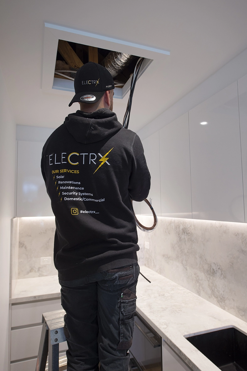 Electrician working on switchboard maintenance
